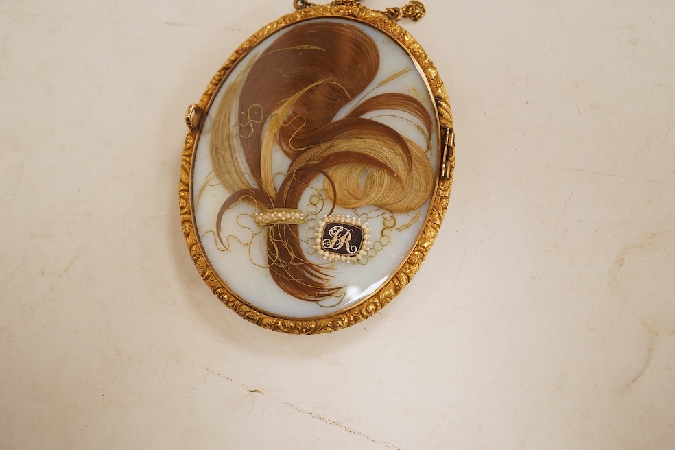 Thomas Richmond (1771-1837), portrait miniature on ivory, Portrait of Francis Robinson, with hair work and seed pearls verso, housed in a gilt metal case, 11cm high. CITES Submission reference EF4KBE7V